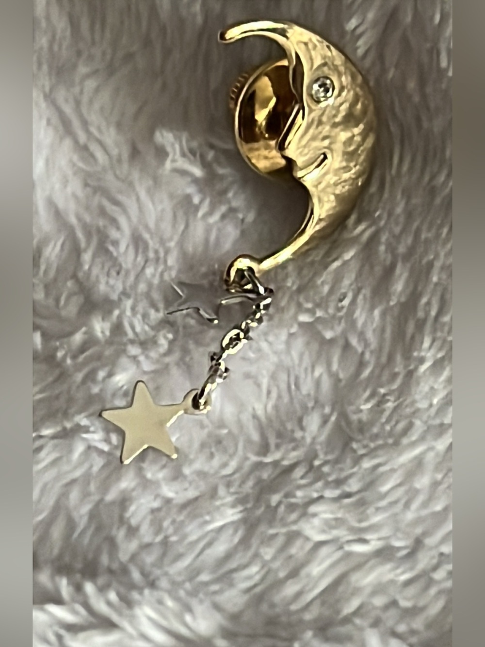 Avon Gold crescent moon face jewelry pin.